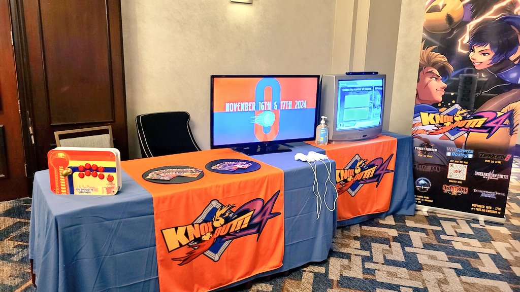 A table advertising KNOX-OUT 2024 at the event Climax of Night.