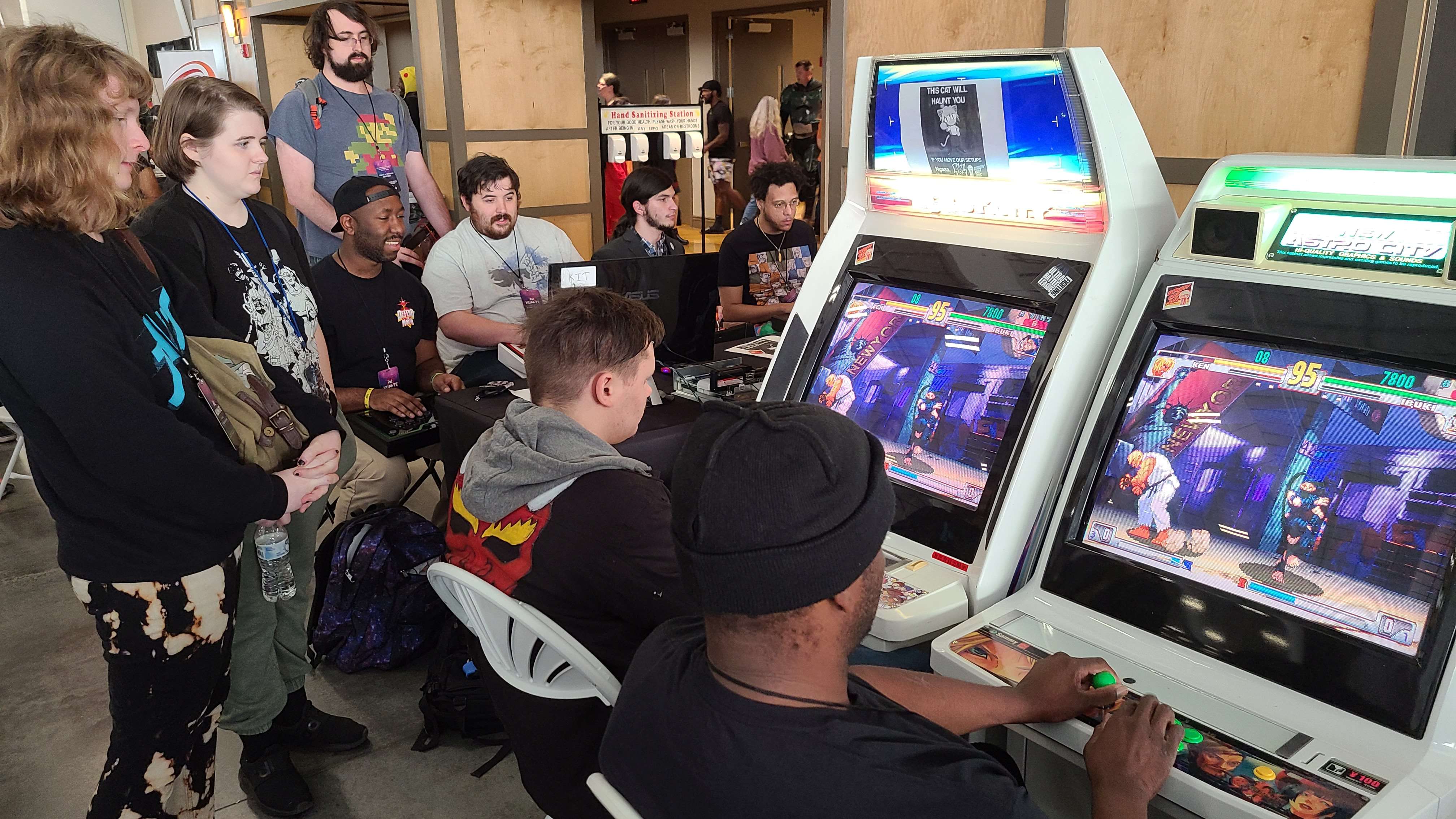 Cabinets and Other consolized hardware for Street Fighter 3 being played at KIT 2022.
