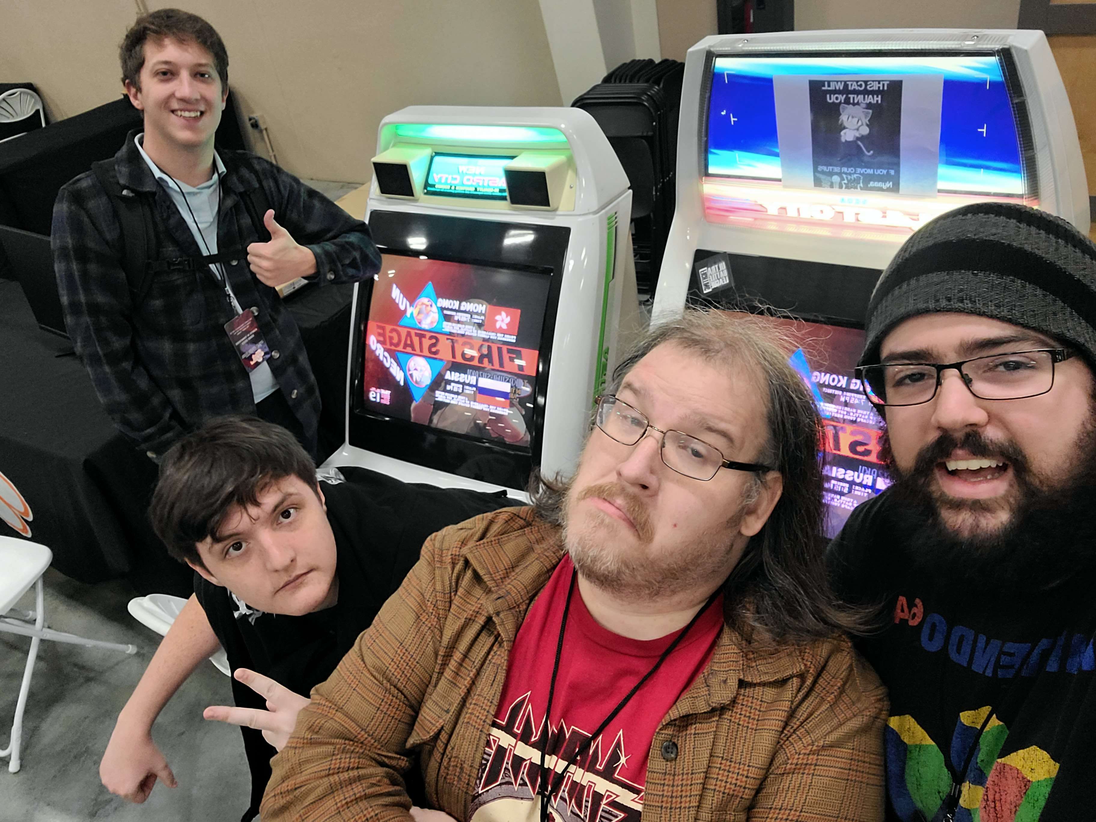 Our core team with my machines at KIT 2022 - myself on the right with our previous lead to my left.